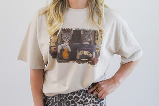 Sand-colored Blissful Ignorance T-shirt by Laura J Stratton with a front design, casual fit, and soft fabric.