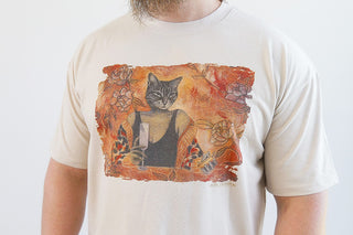 Sand-colored Laura J Stratton "Here Without You" T-shirt with relaxed fit and cat lady art front design.