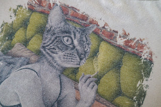 Close-up of a beige T-shirt with "Welcoming Tuesday" printed on the front, designed by Laura J Stratton.